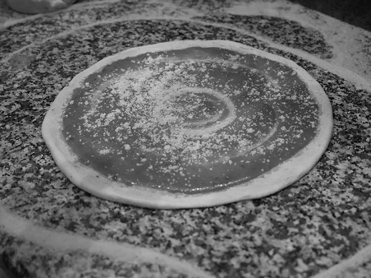 Classic Cheese Pizza Being Assembled